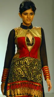 A model catwalks in an outfit design by Kaushik and Pallob during the Kolkata Fashion Week in Kolkata on 10th Sep 2009