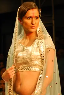 A model catwalks in an outfit design by Abhishek Vyas during the Kolkata Fashion Week in Kolkata on 10th Sep 2009