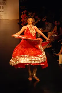 Mode walksl on the ramp of Anita Dongre''s timeless collection for spring/summer 2010 at Lakme Fashion Week was a stylish nostalgic fashion odyssey