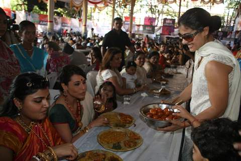 Kajol serves food to Rani Mukherjee at a Durga Pooja pandal in Mumbai