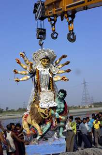 Devotees carrying the &quot;Durga Idol&quot; for immersion in the river Yamuna in New Delhi on Monday 28th September 2009It marks the end of the four day long Durga puja festival mostly celebrated by the Bengali community throughout India and