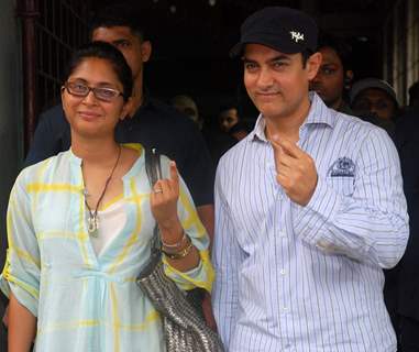 Aamir Khan & wife Kiran Rao pose after casting his votes today for Maharashtra Elections