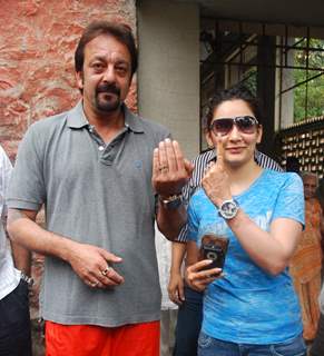 Sanjay & Manyata Dut tpose after casting his votes today for Maharashtra Elections