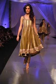 A model showcasing designer Manish Malhotra''s creation on the ramp at the HDIL India Couture Week in Mumbai Wednesday night