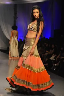 A model showcasing designer Manish Malhotra''s creation on the ramp at the HDIL India Couture Week in Mumbai Wednesday night