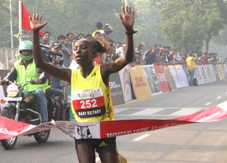 Kenya''s Mary Keitany won the women''s race in the Airtel Delhi Half Marathon , clocking a new record of 66 min:54 sec,in New Delhi on Sunday ( Photo: IANS)