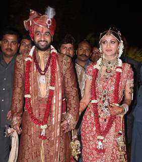 Bollywood Actress Shilpa Shetty and London based businessman Raj Kundra pose for the media after their marriage Ceremony in Khandala