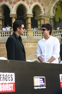 Bollywood actor-director Farhan Akhtar and Karan Johar pose for the photographers during the launch of new communication campaign ''HIV'' and ''Soul Cages''