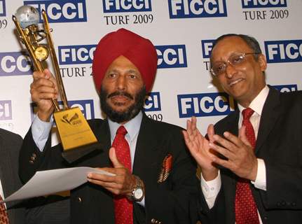 FICCI Sec Gen Dr Amit Mitra presenting sports awards to Milkha Singh in New Delhi on Wednesday 16 Dec 2009