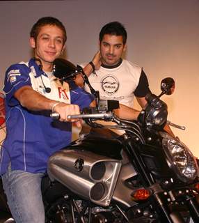 Motogp world champion Valentino Rossi and Bollywood actor John Abraham at a press meet in New Delhi on Sunday