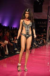 Model walks on the ramp for designer Malini Ramani at Lakme Fashion Week 2010