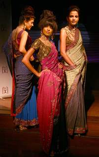 Models showcasing  designers Rahul,Gunjan and Payal Gupta''s creations  at the unveiling of bridal collections