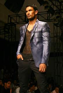 A model showcasing designer Troy Costa''s creations at the Ven Heusen India Mens Week, in New Delhi