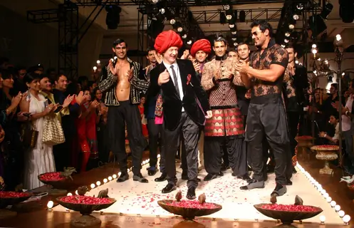Designer Rohit Bal with Bollywood actor John Abraham  during his show  at the Ven Heusen India Mens Week, in New Delhi