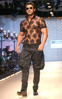 John Abraham showcasing designer Rohit Bal''s creation at the Ven Heusen India Mens Week, in New Delhi