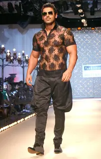 John Abraham showcasing designer Rohit Bal''s creation at the Ven Heusen India Mens Week, in New Delhi