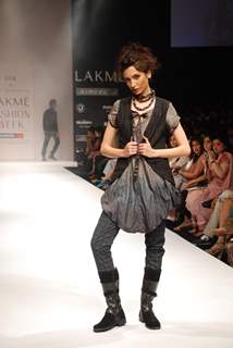 A model walks the runway in an Viia design at the Lakme Fashion Week