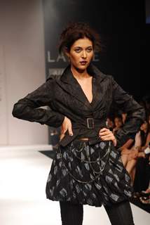 A model walks the runway in an Viia design at the Lakme Fashion Week