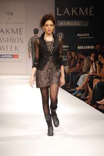 A model walks the runway in an Viia design at the Lakme Fashion Week