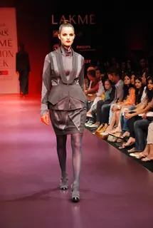 A model walks the runway in an Arjun Saluja design at the Lakme Fashion Week