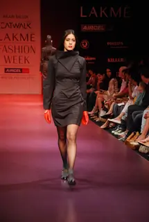 A model walks the runway in an Arjun Saluja design at the Lakme Fashion Week