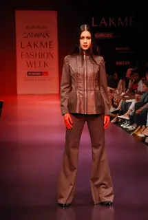 A model walks the runway in an Arjun Saluja design at the Lakme Fashion Week