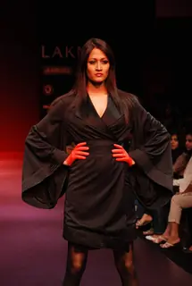 A model walks the runway in an Arjun Saluja design at the Lakme Fashion Week