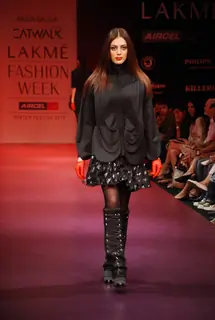 A model walks the runway in an Arjun Saluja design at the Lakme Fashion Week