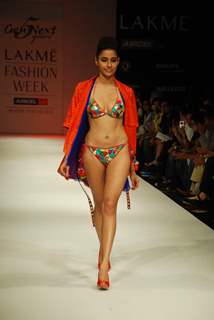 A model walks the runway in an Gen Next design at the Lakme Fashion Week