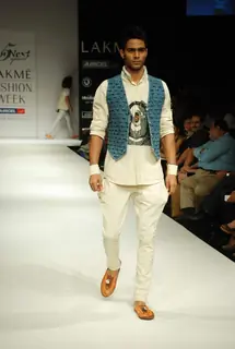 A model walks the runway in an Gen Next design at the Lakme Fashion Week