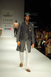 A model walks the runway in an Gen Next design at the Lakme Fashion Week