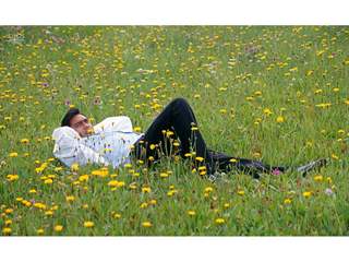 Ajay Devgam lying on the garden