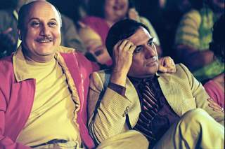 Anupam looking happy and Boman looking confused