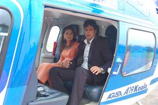 Yudhishtir and Rani sitting on a helicopter