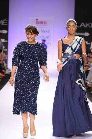 Divya Sheth walks the ramp with one of her designs