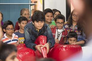 Bhavya Gandhi plays a game of Air Soccer at the Launch of the 10th Planet-Happy Planet with Smilo