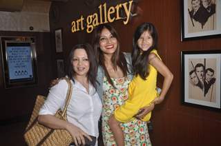 Bipasha Basu poses with a friend and a kid at the Special Screening of Creature 3D