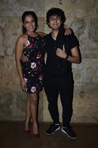 Sonu Niigam poses with Richa Chaddha at the Special Screening of Tamanchey