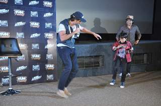 Hrithik Roshan shakes a leg with a young fan at the Special Screening of Bang Bang