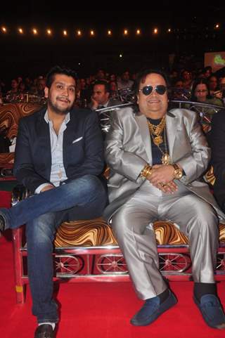 Bappi Lahiri and Bappa Lahiri smile for the camera at Umang Police Show