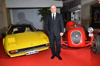 Anupam Kher poses for the media at the Red Carpet Premier of Baby