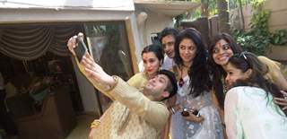 Bappa Lahiri clicks a selfie with friends at his Saraswati Pooja