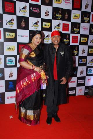 Anandan Sivamani poses with wife at Radio Mirchi Awards