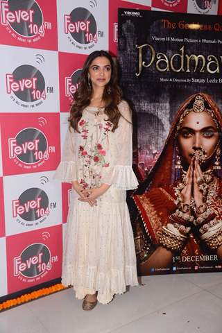 Deepika poses with the poster of her film, Padmavati