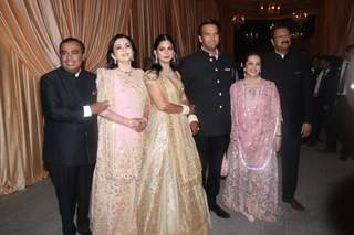 The Ambani Family poses for shutterbugs at Isha Ambani and Anand Piramal Wedding Reception