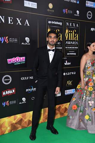 Ahan Shetty poses to paparazzi at green carpet of IIFA awards 2022 in Abu Dhabi