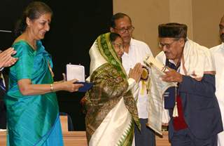 President Pratibha Devi Singh Patil presenting ''''Dadasaheb Phalke award 2007'''' to Manna Dey at Vigyan Bhawan, in New Delhi on Wednesday, also in photo I and B minister Ambika Soni