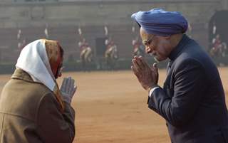 Prime Minister Manmohan Singh and President Pratibha Patil exchange greetings after the ceremonial welcome of the visiting South Korean President Lee Myung-Bak at the Rashtrapati Bhavan in New Delhi on Monday