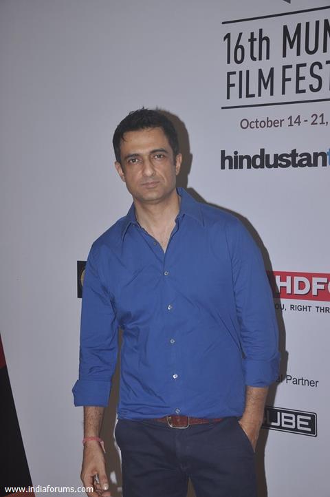 Sanjay Suri poses for the media at the 16th MAMI Film Festival Day 5