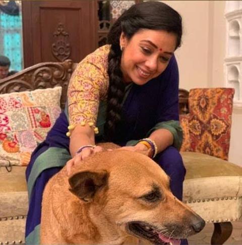 Rupali Ganguly with a dog on the sets of Anupamaa